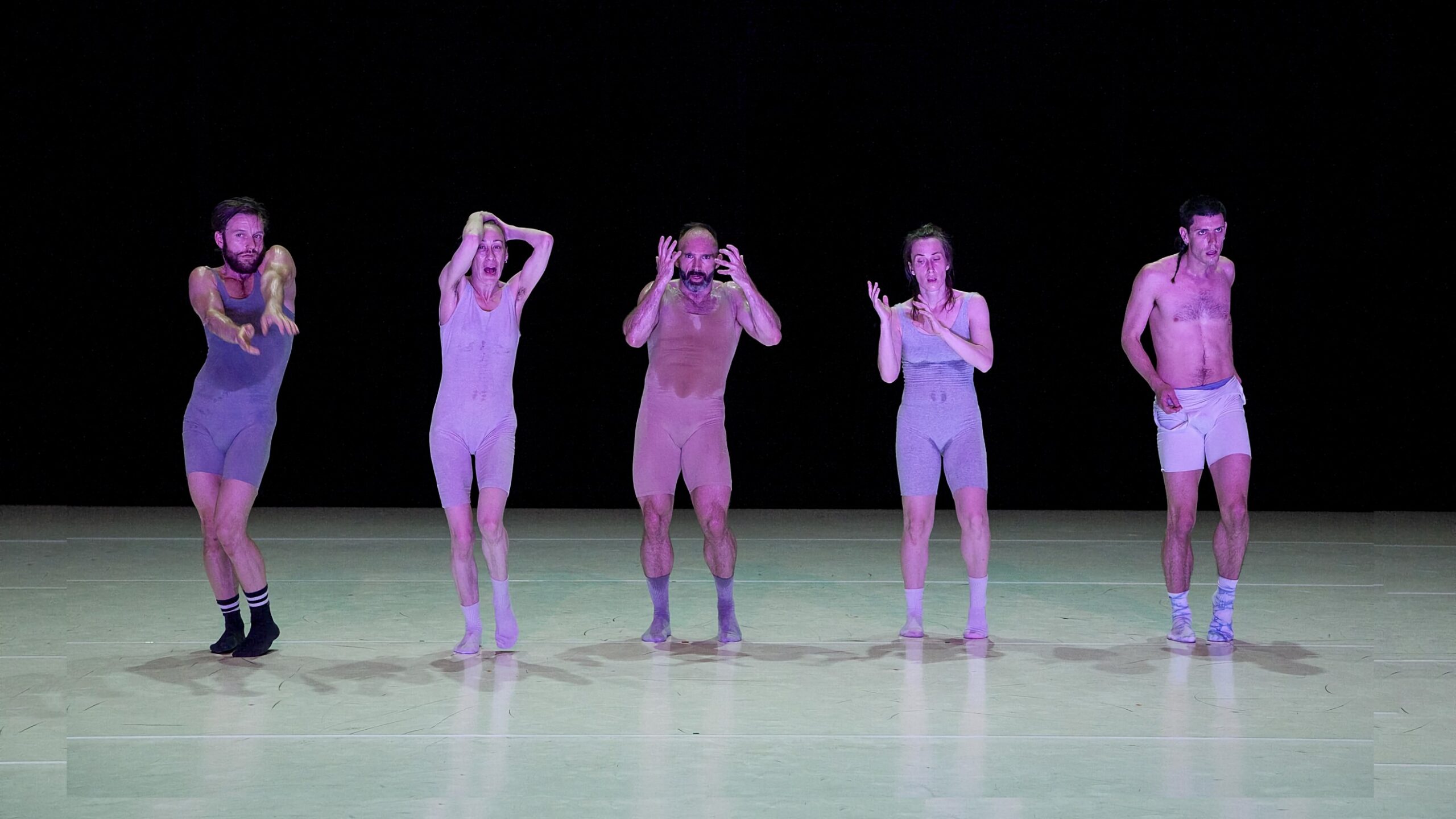 a group of people dancing on a stage