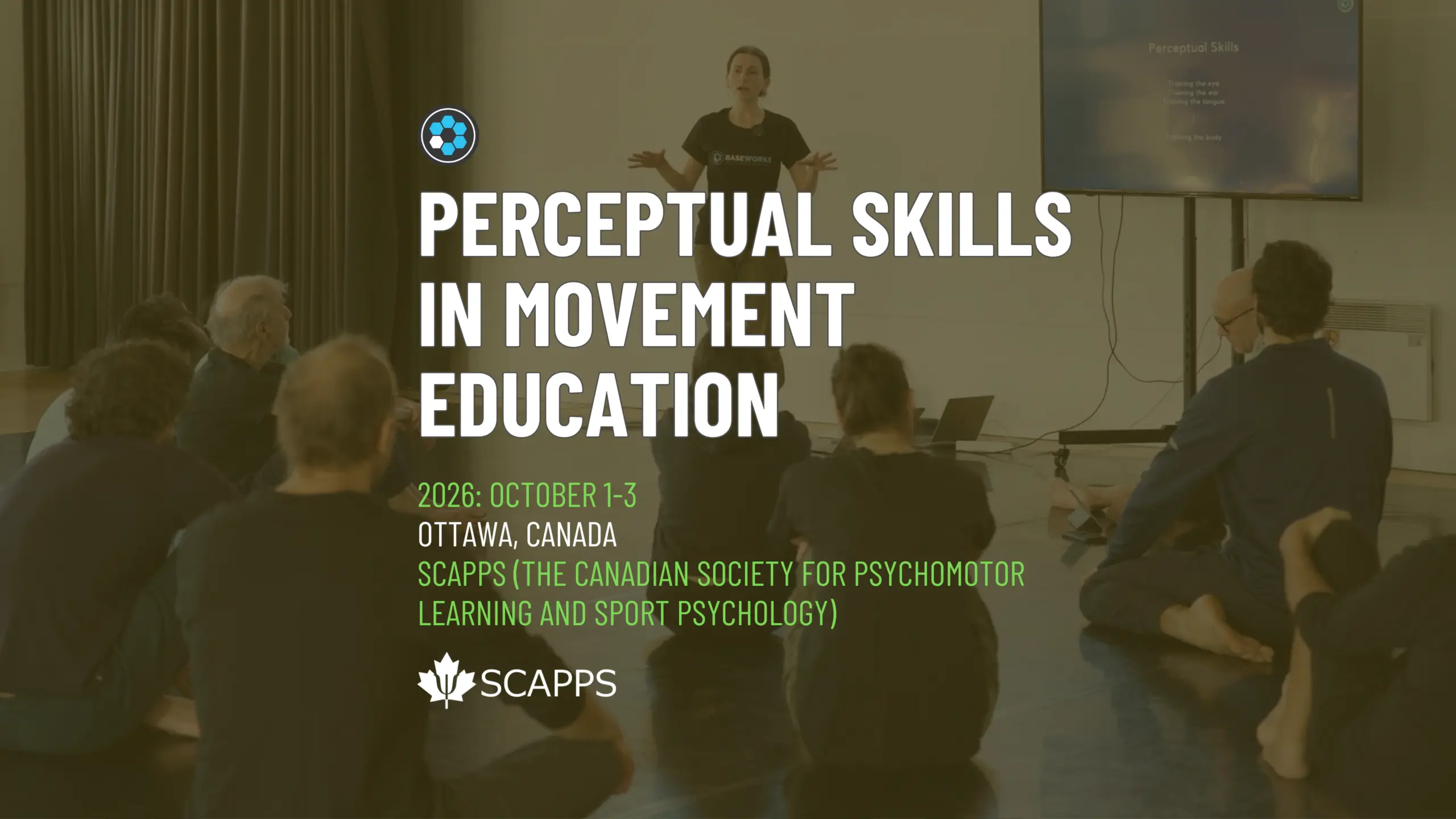 A presenter in a black Baseworks T-shirt stands at the front of a studio with arms open, speaking to a group seated on the floor with their backs to the camera, a screen titled Perceptual Skills beside her. Title text reads Perceptual Skills in Movement Education, 2026: October 1-3, Ottawa, Canada, SCAPPS (The Canadian Society for Psychomotor Learning and Sport Psychology).