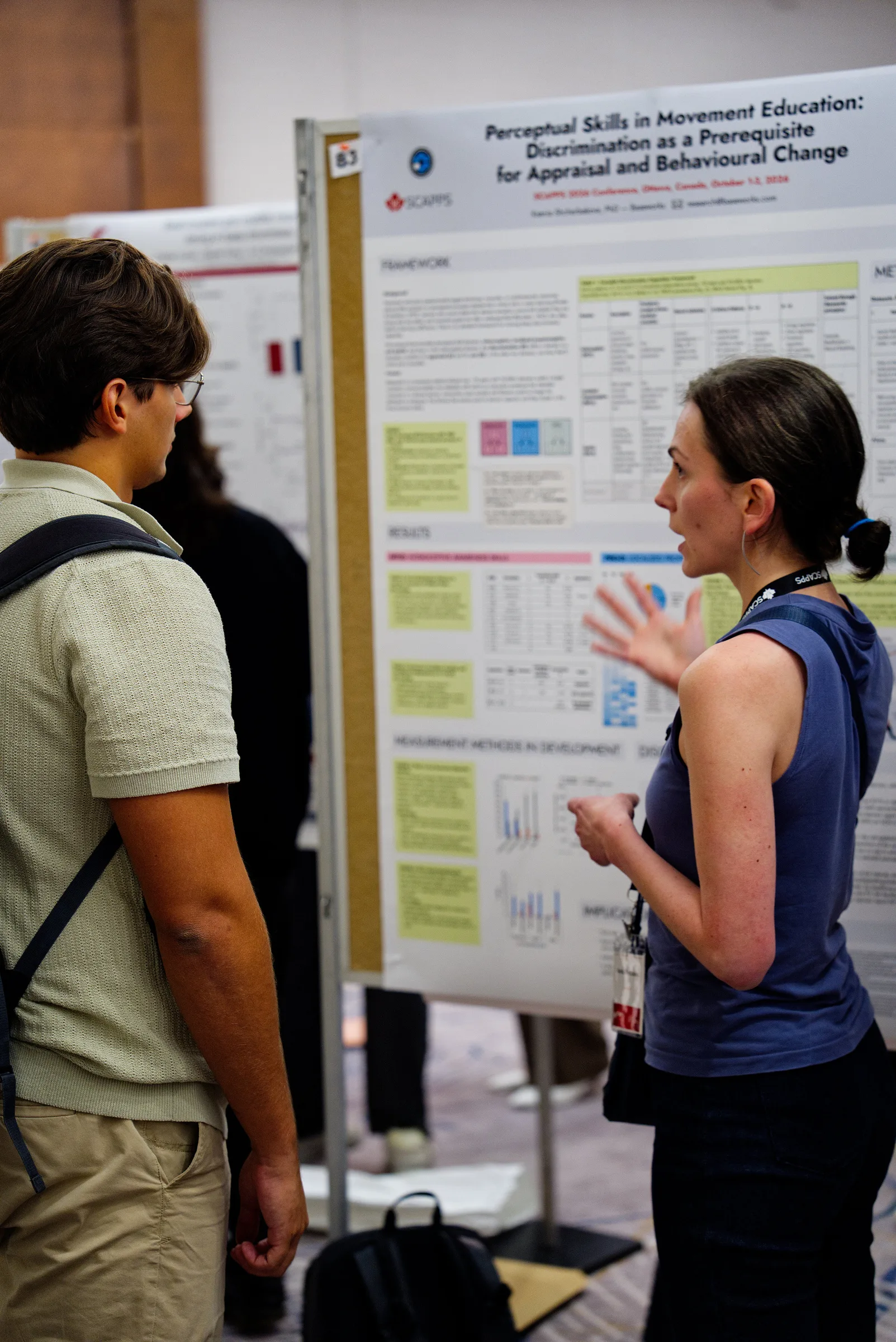 Ksenia Asia Shcherbakova discusses our research with a visitor at the Baseworks poster, Perceptual Skills in Movement Education, at SCAPPS 2026 in Ottawa.