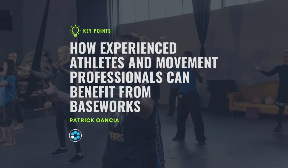 Text in image says "How Experienced Athletes And Movement Professionals Can Benefit From Baseworks" by Patrick Oancia. In the background, several people are doing standing practice in a large room.