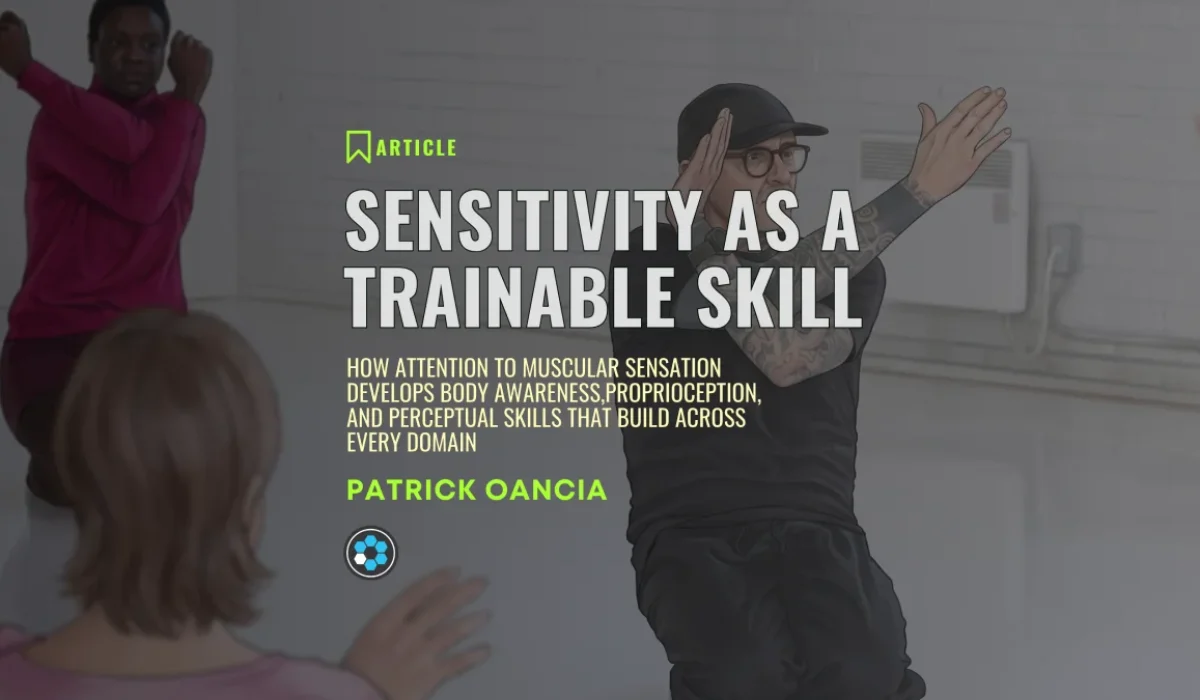Article banner reading Sensitivity as a Trainable Skill by Patrick Oancia, set against a soft-focus studio photograph of a Baseworks practice session.